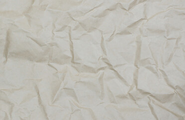 Texture of crumpled paper. Background from crumpled beige paper.