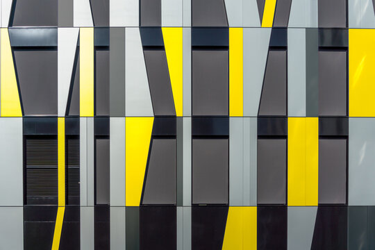 Yellow and Gray Decorative Facade Cladding Panels of Irregular Shapes. Geometric Facade. Modern Building. Abstract Architecture Photography.