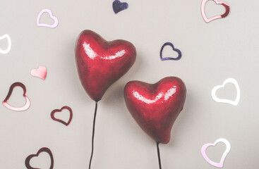 Valentine's day red hearts on a beige background.