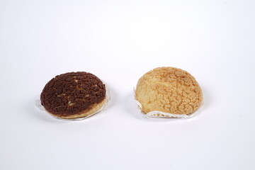 French traditional Choux pastry ball. Choux with  filling chantilly cream. Fresh golden profiterole or Pate a choux. Selective focus. Cream Puffs, choco vanilla Choux isolated on white background. 
