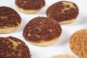 French traditional Choux pastry ball. Choux with  filling chantilly cream. Fresh golden profiterole or Pate a choux. Selective focus. Cream Puffs, choco vanilla Choux isolated on white background. 
