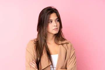 Teenager Brazilian girl over isolated pink background thinking an idea