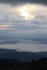 Landscape photos Nature from the top of the mountain There are many trees And clouds above And there are shadows from the clouds Light shade of sunlight Gives a cool feeling Ideas for travel pictures.