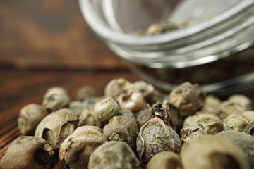 Macro photo of.green peppercorns on table