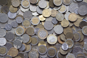A Pile Of New And Old Colombian Coins Of Different Denominations. Saving Colombian Coins.