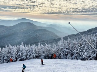 Beautiful mountains view with clouds at snow day at the Stowe Mountain Ski resort Vermont -...