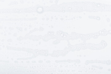 Abstract background white soapy foam texture. Shampoo foam with bubbles