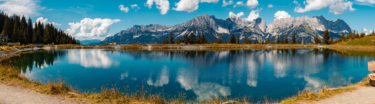 High resolution stitched panorama of a beautiful alpine summer view with reflections in a lake at the famous Astberg summit, Going, Wilder Kaiser, Tyrol, Austria