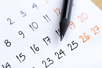 Fototapeta premium white calendar page for 2021 month schedule to make an appointment or manage the schedule every day with ballpoint pen for marks