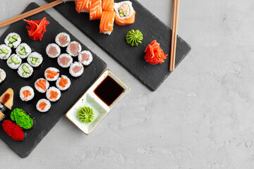 Maki sushi set served on black stone tray