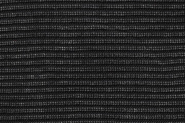 The texture of the machine knitted sweater fabric.