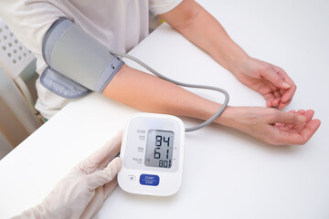 Man measures blood pressure