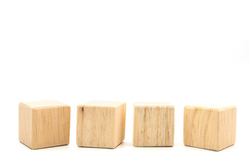 Four brown wooden blocks placed side by side on a white background.