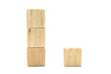 A total of 4 brown wood blocks, 3 of which are stacked on the left side. And the other one is placed to the right of 3 wooden blocks with a white backdrop.