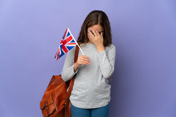 Child holding an United Kingdom flag over isolated background with tired and sick expression