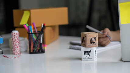 Online shopping cart boxes blurred background with online trade ideas box