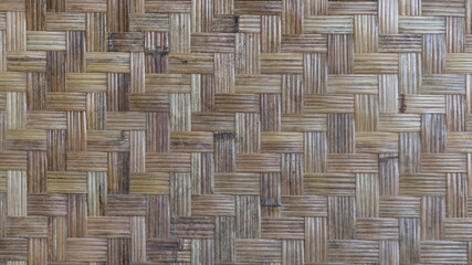 Woven bamboo wall with a beautiful pattern and can be used as a background.