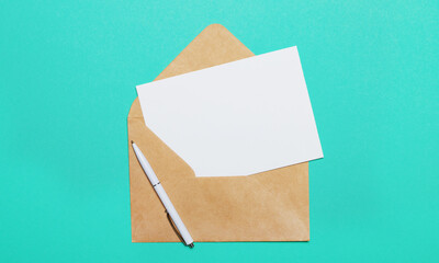 On a green background - an open craft envelope and an empty card for inserting text or illustrations.