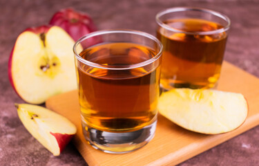 
Two glasses of apple juice.
Close-up.