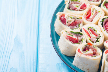 Sliced sandwich tortilla with vegetables and ham