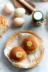 Ingredients for a healthy breakfast, nuts, oatmeal, honey, berries, fruits, blueberry, orange, pomegranate seeds, almonds, walnuts. The concept of natural organic food in season. Bread