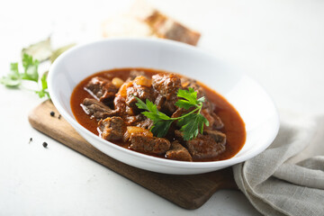 Healthy homemade beef goulash with fresh parsley