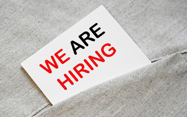 Sticker in the pocket with WE ARE HIRING text. Human resources.