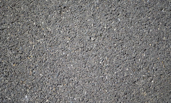 Black macadamized road or asphalt road pavement surface with copy space for background.