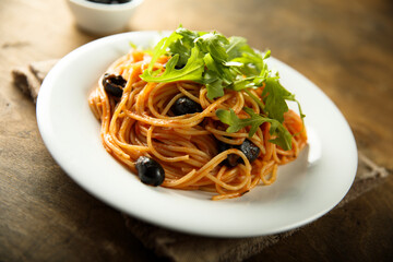 Pasta with olives and arugula