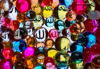 Fototapeta na wymiar Colorful glass balls with Allah names reflection. Perfect for background islamic concept. 