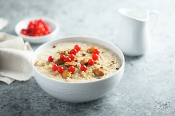 Healthy oatmeal porridge with berries and almond