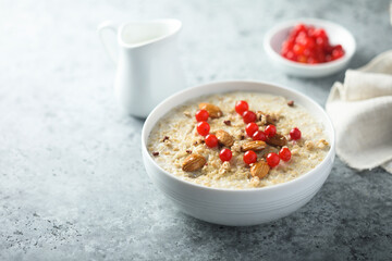 Healthy oatmeal porridge with berries and almond
