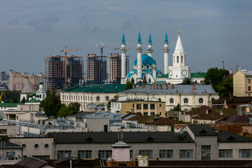 Panorama of Kazan and the concept of contrast between the new and the old city. Mosque against the background of new buildings and high-rise buildings.