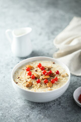 Healthy oatmeal porridge with berries and almond