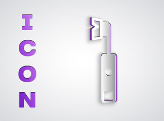 Paper cut Electric toothbrush icon isolated on grey background. Paper art style. Vector.