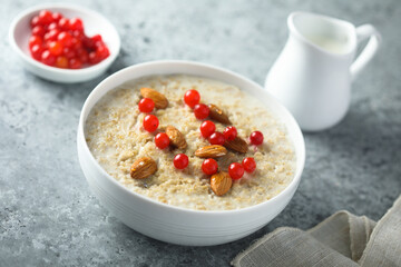 Healthy oatmeal porridge with berries and almond