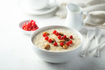 Healthy oatmeal porridge with berries and almond