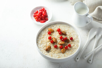 Healthy oatmeal porridge with berries and almond
