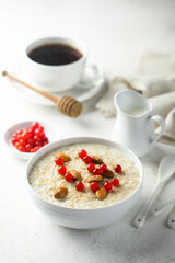 Healthy oatmeal porridge with berries and almond