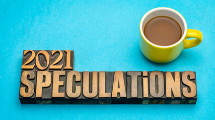 2021 year speculations  concept - text in vintage letterpress wood type printing blocks with a cup of coffee, expectations and predictions for the New Year