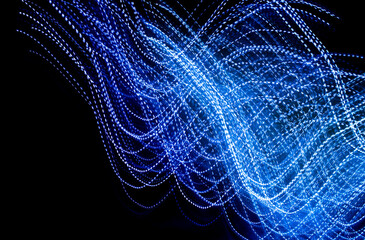 blue dashed lines of lights on a black background