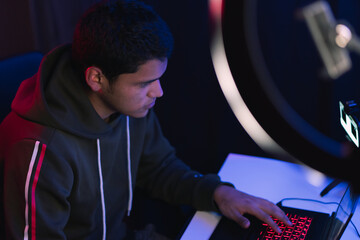 Young man doing a live video game sharing online.