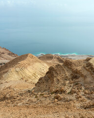A rocky slope leading to the seashore.  Panorama from multiple shots.