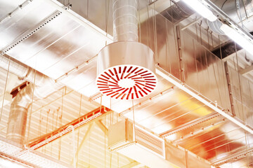 Supply and exhaust ventilation system on ceiling of commercial room or warehouse