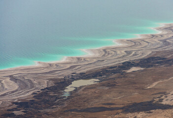 Dead sea coast with open pits.