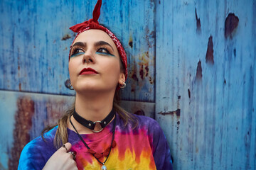 Young woman with urban style posing on the street.