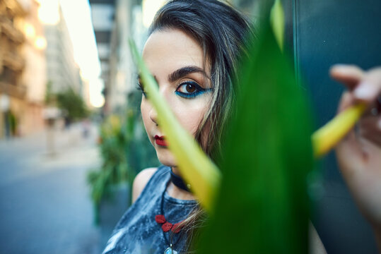 Young woman with urban style posing on the street.