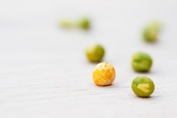 green and yellow peas on white background