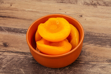 Marinated peaches fruit in the bowl