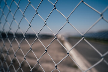 close up of chain link fence with wire